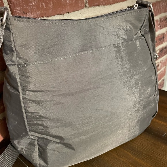 Baggallino Crossbody Bag. Color-taupe. Zipper closures, adj strap. Nylon/Poly. - Picture 6 of 10